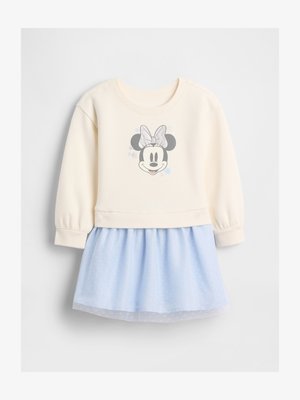 Kremna majica z dolgimi rokavi z Minnie Mouse obrazom in srebrnim pentljem, kombinirana s svetlomodro krilom iz tila z nežnim pikčastim vzorcem.