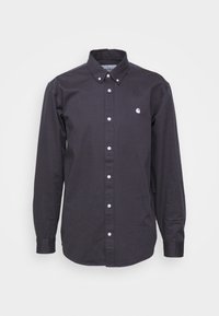 Camicia scura a maniche lunghe con bottoni e colletto, realizzata in tessuto liscio. Presenta bottoni bianchi e un piccolo logo sul petto.