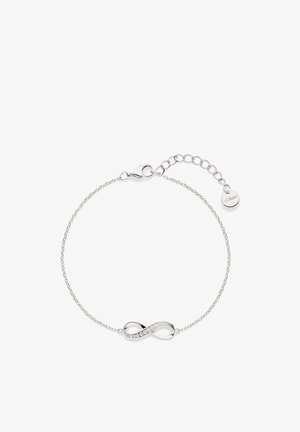 Bracelet en chaîne argentée avec un pendentif symbole infini, orné de pierres transparentes, une fermeture à mousqueton et une chaîne ajustable pour la taille.