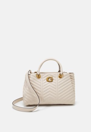 Borsa beige trapuntata con motivo a zig zag, hardware dorato, doppi manici superiori e tracolla removibile. Accento con logo sulla parte anteriore.