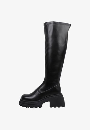 Bottes noires en cuir montant jusqu'aux genoux, avec une semelle plateforme épaisse et texturée. Bout arrondi et design sans coutures ni éléments visibles.