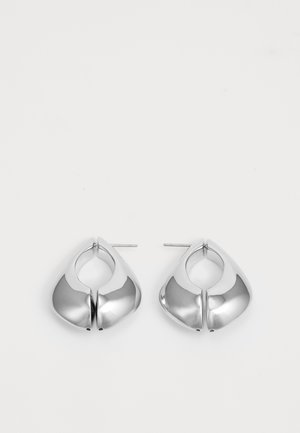 Silver hoop earrings featuring a curved, teardrop shape with a polished finish and a post backing for secure wear.