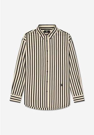 Camisa abotonada en color crema con Rayas verticales negras. Mangas largas con puños a rayas, dobladillo redondeado y un pequeño logo en el lado izquierdo.
