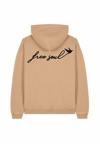 Felpa beige con cappuccio regolabile e polsini a coste. "Anima libera" in testo corsivo nero con una grafica di un uccello stampata sul retro.