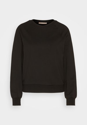 Must-Black särgid, millel on ümmargune kaelus, pikad raglan-sleevad, elastsed mansetid ja kohandatud hem. Valmistatud pehmest kangast, minimalistlik disain.