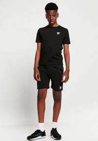 11 DEGREES Pantalones deportivos - black