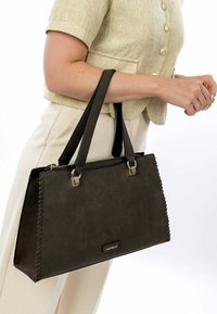 Dark brown handbag with sleek design, faux leather texture, dual top handles, silver hardware, and decorative stitching along the edges.