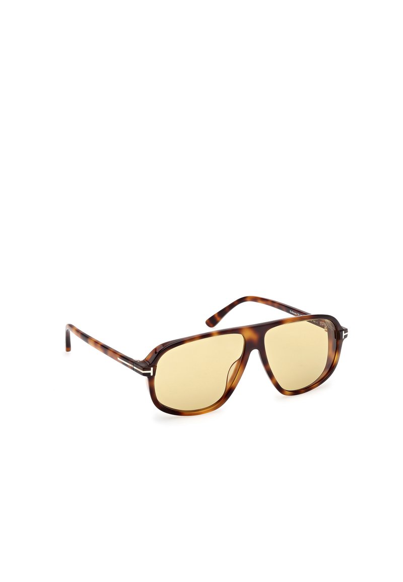 Occhiali da sole in tartaruga marrone con design quadrato, lenti gialle e dettagli metallici sottili sulle astine per un tocco di raffinatezza.