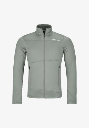 Hellgrüne Fleecejacke mit Reißverschluss, langen Ärmeln, strukturiertem Stoff und dezenten Nahtdetails. Verfügt über zwei seitliche Taschen und einen hohen Kragen.