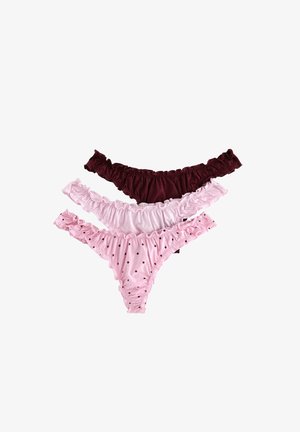 Drie paar damesondergoed: kastanjebruin, effen roze en lichtroze met zwarte stippen. Allemaal met gerimpelde randen en zachte stof.