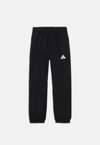 Pantaloni sportivi neri con vita regolabile tramite cordino, polsini elastici e un'accattivante logo Adidas bianco sulla coscia sinistra. Tessuto dalla texture liscia.