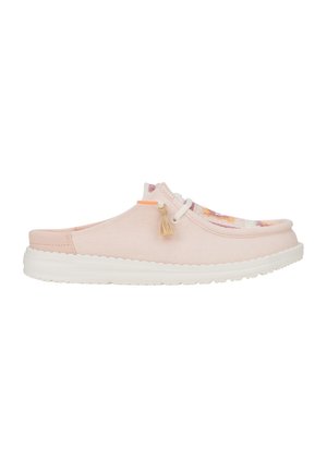 Light pink canvas slip-on shoe with a white rubber sole, featuring floral design accents and a decorative tassel on the upper.