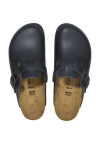 Black leather clogs with a smooth finish, adjustable strap, and contoured, tan-colored insole. Size 38 printed on the footbed.