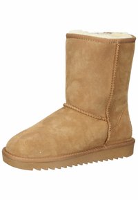 Hellbraune Wildleder-Stiefelette mit weichem Innenfutter, abgerundeter Spitze und einer strukturierten Gummisohle mit Zickzackmuster.