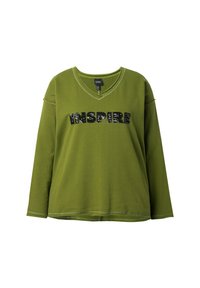 Camisa verde de manga larga con cuello en V, con la palabra "INSPIRE" en pailletes negros en el frente. Tejido de algodón suave con un corte relajado.