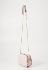 Pink quilted handbag with a rectangular shape, featuring a chain strap and a smooth leather top handle, gold zipper and hardware accents.