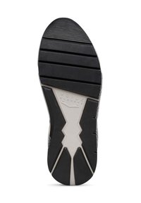 Suola di scarpa in gomma nera con scanalature orizzontali e diagonali, caratterizzata da un motivo a zigzag bianco centrale e dettagli del logo in rilievo.