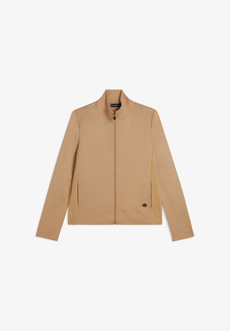Veste beige zippée avec un col haut, des manches longues, des panneaux latéraux contrastés et un petit logo sur le bas à l'avant. Texture du tissu douce.
