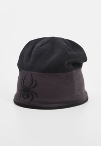 Berretto lavorato a maglia nero con orlo ripiegato. Presenta una grafica di un ragno grigia scura sul davanti, una texture morbida e una forma semplice e arrotondata.