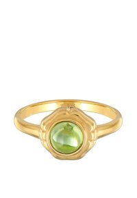 Bague en or avec un sertissage en forme de fleur, présentant une pierre précieuse verte lisse et ronde au centre. La monture est mince et polie.