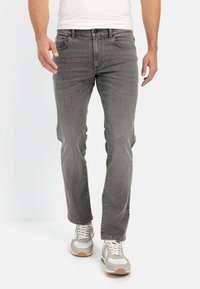 Gray denim jeans with a straight leg cut, five-pocket design, and subtle fading. Worn with white and gray athletic sneakers.
