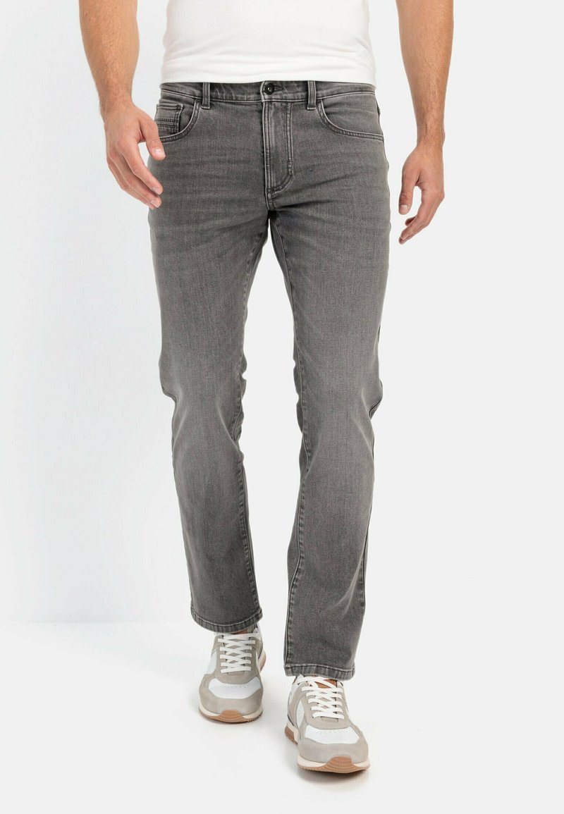 Gray denim jeans with a straight leg cut, five-pocket design, and subtle fading. Worn with white and gray athletic sneakers.