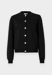 Black jacket with a round neckline, herringbone texture, and gold button closure. Features side pockets and ribbed cuffs and hem.