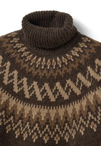 Brown knitted sweater with a ribbed turtleneck. Features geometric patterns in light brown and cream, contrasting against a dark brown base.