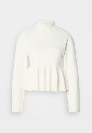 Hvid langærmet top med høj hals og peplum-udsmykning. Blødt, struktureret stof med en tætsiddende overdel og en udvidet nederste del.