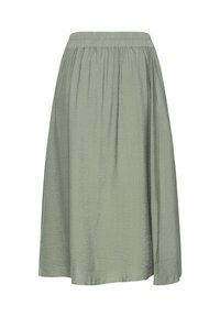 Jupe verte, mi-longue, en tissu léger avec une finition texturée. Dotée d'une taille élastique pour le confort. Design simple, sans motifs.