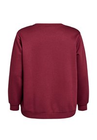 Sweatshirt bordeaux avec une coupe décontractée. Il possède un col rond, des manches longues et des poignets côtelés. Texture lisse sans motifs visibles.