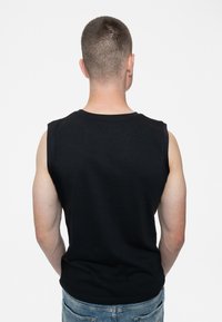 Black sleeveless shirt made of cotton, with a crew neck and simple design. The back is plain and the fabric appears smooth.