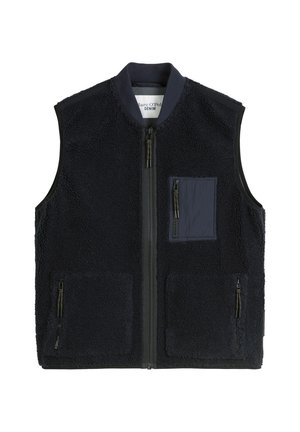 Navy blue fleece vest with a front zipper. Features a left chest pocket and two zippered side pockets. Soft texture and sleeveless design.