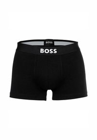 Boxers negros con una cinturilla elástica de marca que presenta "BOSS" en blanco, material de algodón suave, diseño ajustado y longitud hasta el muslo.