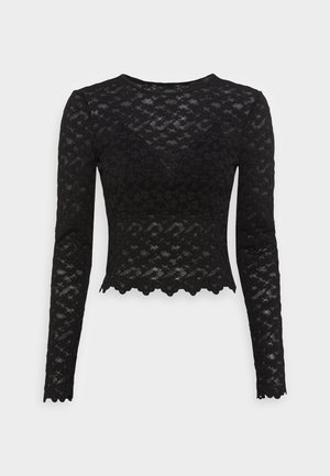 Sort langærmet blonder crop top med blomsterprint, bølget kant ved skørt og ærmer samt en tætsiddende silhuet.