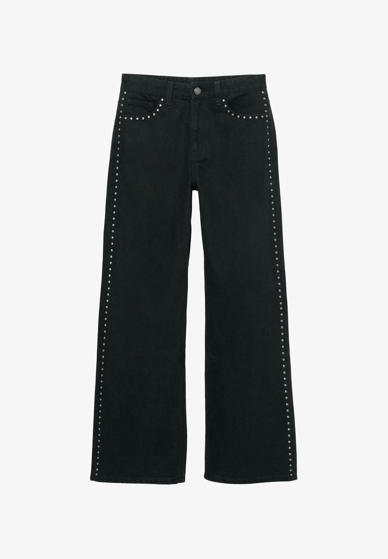 Črne kavbojke širokih nog z okraski iz kovinskih zakovic vzdolž stranskih šivov. Izdelane iz jeansa s klasičnim dizajnom s petimi žepi.