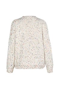 Gebreide trui in off-white met kleurrijke spikkels. Heeft lange mouwen, geribbelde manchetten en een ronde halslijn. Genoptweven stof.
