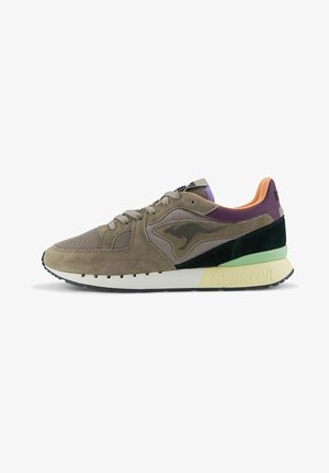 Sneaker with a combination of brown suede and mesh upper, black and green accents, purple rear panel, and a white sole with "DYNACOIL" text.