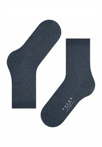 Ciemnoniebieskie wełniane skarpetki z prążkowanymi mankietami, wzmocnieniem palców i pięty oraz napisem "FALKE COSY WOOL" na podeszwie.