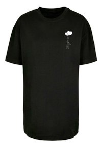 Black cotton t-shirt with a crew neck, featuring a white graphic of a figure holding two balloons on the left chest area.