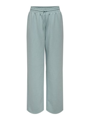 Vaaleansiniset, leveälahkeiset collegehousut, jotka on valmistettu pehmeästä kankaasta. Niissä on joustava vyötärönauha nyörillä ja sivutaskut. Sileä pinta.