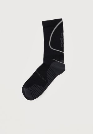 Black crew sock with gray reinforced toe and heel, horizontal stripes on foot sole, and subtle curved line design on leg.