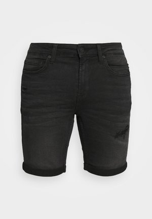 Shorts en denim noir avec un détail déchiré sur la cuisse gauche, des ourlets retroussés, cinq poches et une coupe ajustée.