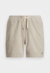 Beige kordflyshorts med elastisk midja, dragsko-stängning och broderad logotyp på nedre vänstra sidan. Vertikal ribbad textur.