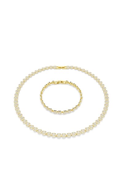 Ensemble de collier et bracelet en ton doré avec des accents de cristaux transparents circulaires, finition polie et fermoirs sécurisés, mettant en valeur des détails de design élégants.
