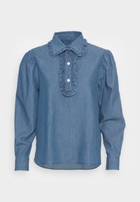 Blå denimskjorta med lång ärm, volangkrage och framknäppning. Har knäppning med knappar och puffärmar. Slät textur genom hela skjortan.