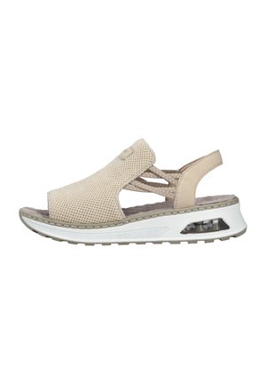 Beige mesh sandal with ankle strap and cushioned insole. Features a white platform sole with visible air cushioning and gray accents.