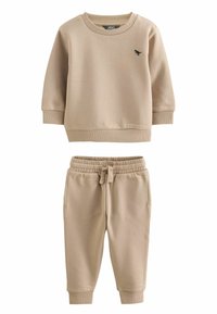 Beige katoenen sweatshirt met geribbelde manchetten en zoom, met een klein zwart logo. Bijpassende beige joggingbroek met elastische tailleband en manchetten.