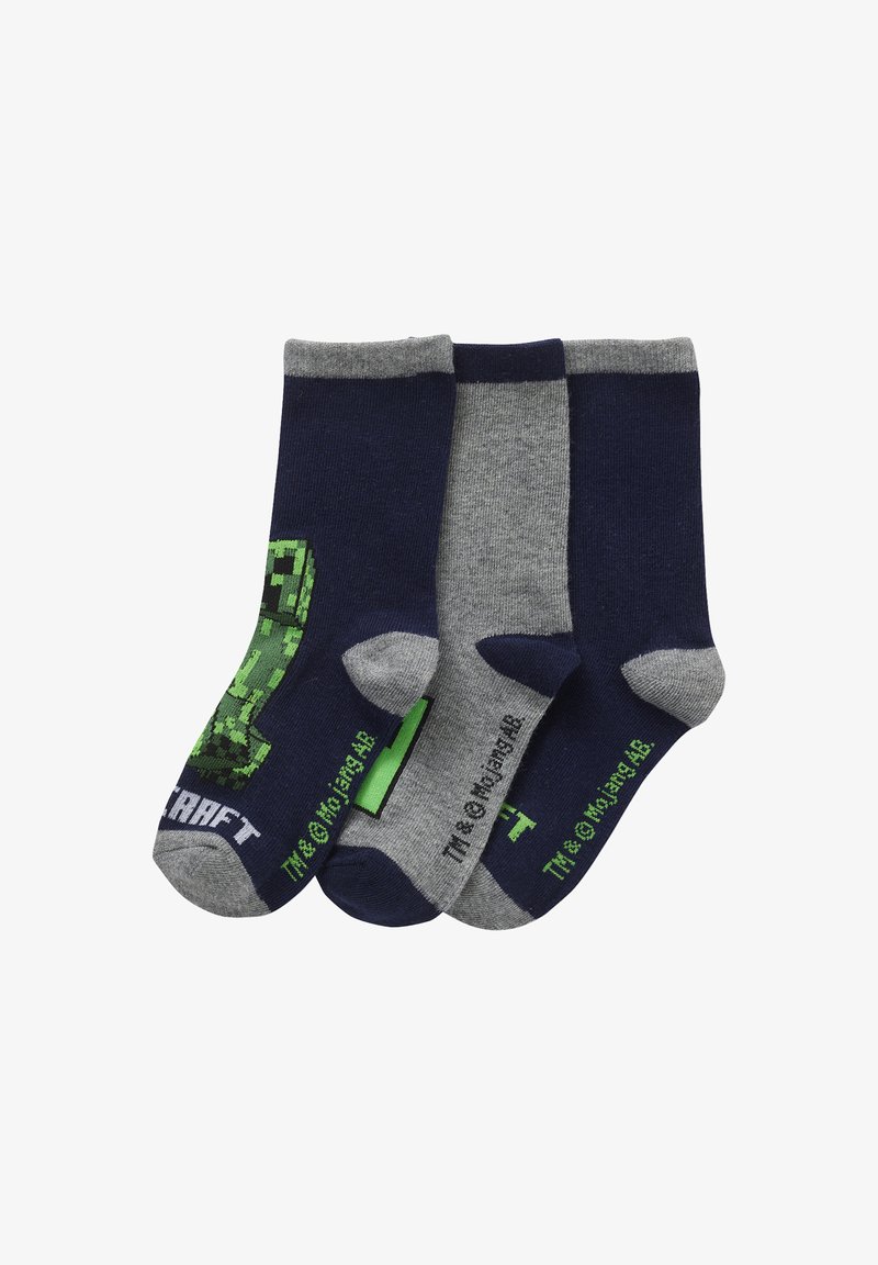 Three pairs of crew socks in navy blue and gray. One sock features a green pixelated design; soft, cotton-blend material.