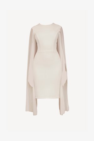 Tettsydd kremfarget kjole med lange, flytende ermer, laget av mykt stoff. Har høy halslinje og en strømlinjeformet silhuett.